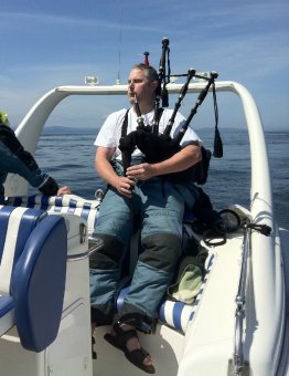 Bag Piper scattering ashes at sea ocean Victoria BC