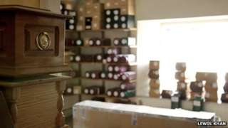 Labelled boxes of uncollected ashes at a Bristol funeral director's premises